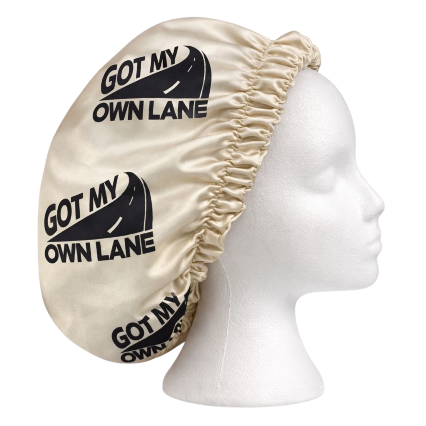 Beige satin hair bonnet with Got My Own Lane logo shown from side view